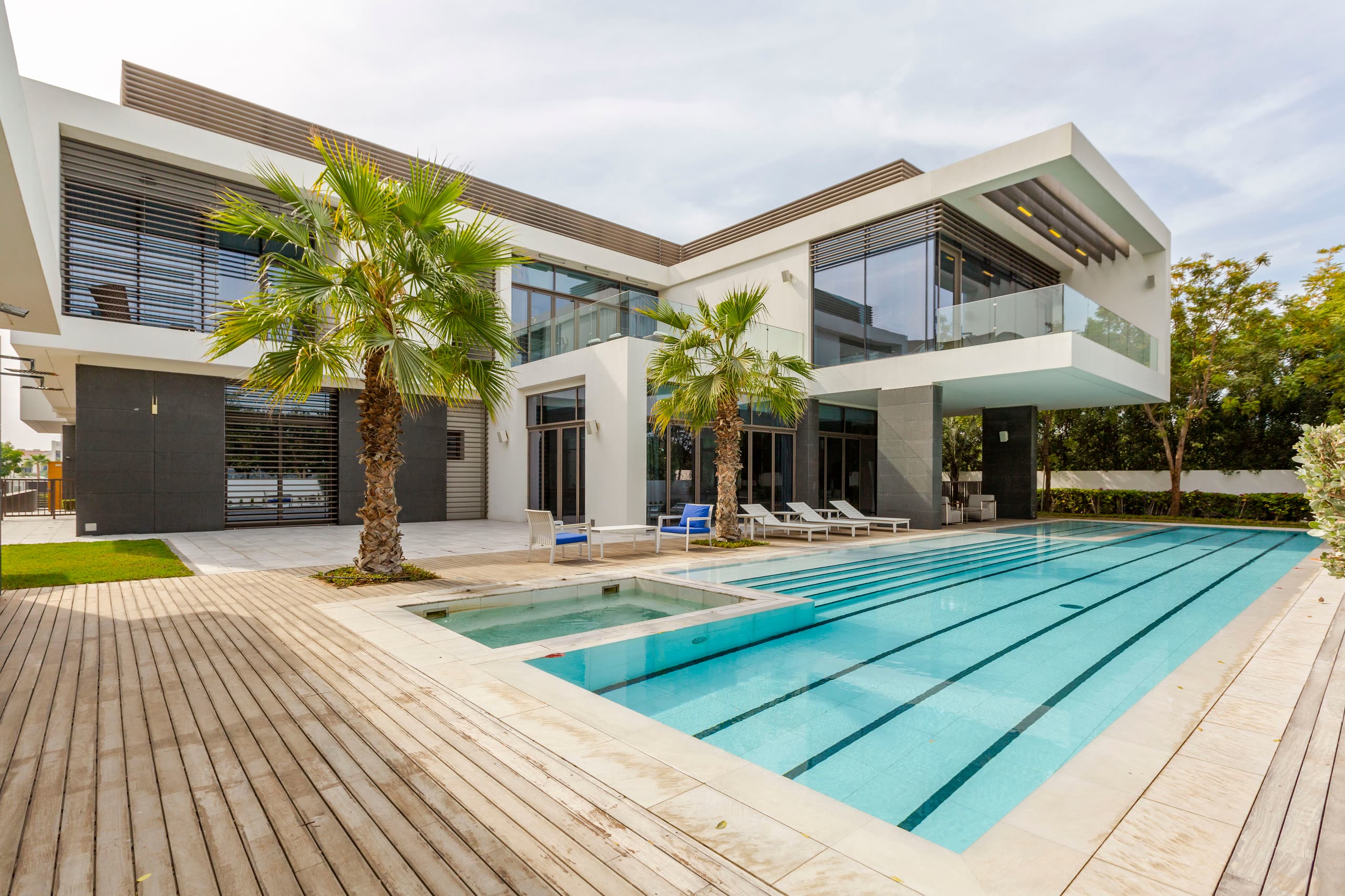 A contemporary villa with a lap pool and timber deck in Dubai